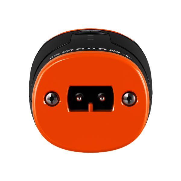 Close-up of an orange and black cylindrical object on a white background
