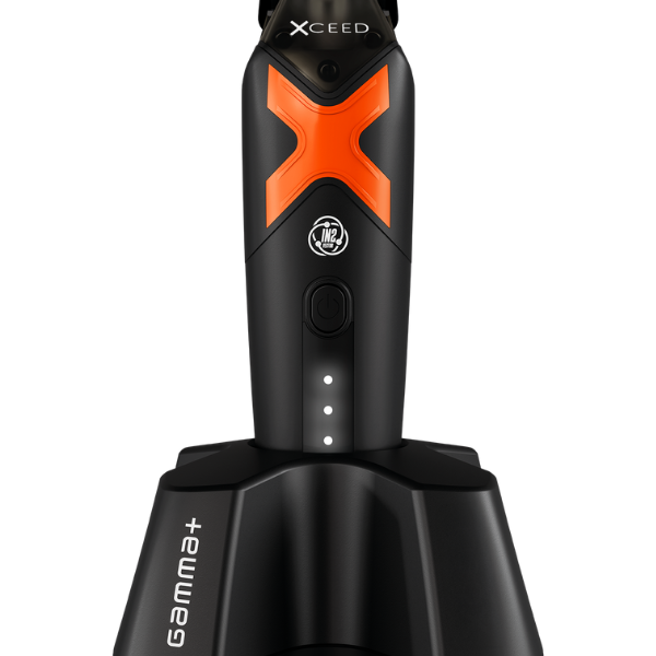 Black and orange grooming tool with 'Xceed' branding on a white background